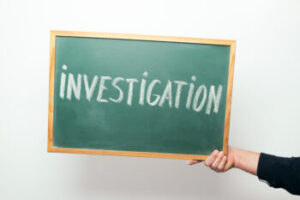 Police investigation board displaying the word "Investigation," representing criminal cases handled by a La Jolla criminal defense attorney.