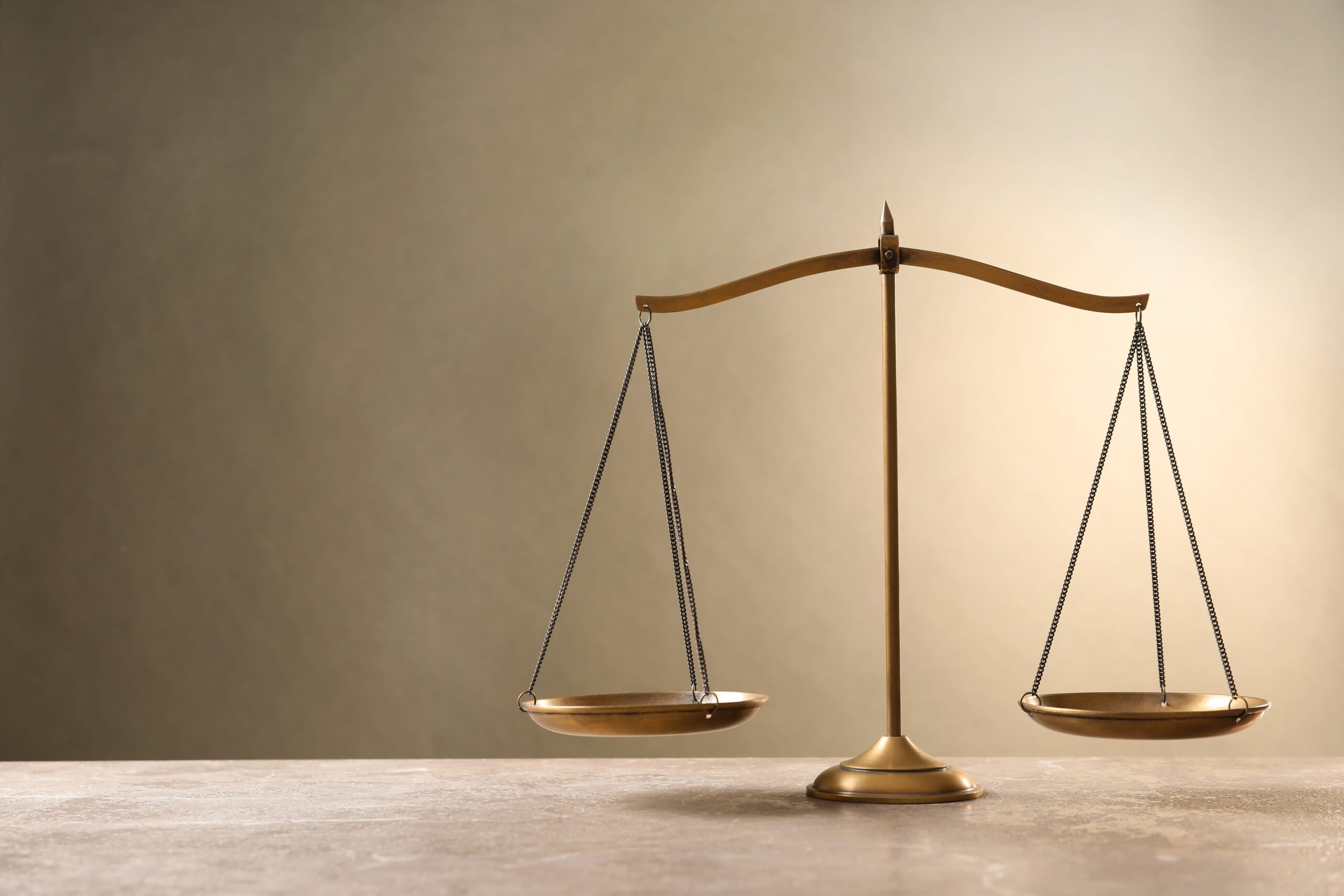 The scales of justice representing the fair legal representation provided by a Newport Beach criminal defense attorney in Orange County.