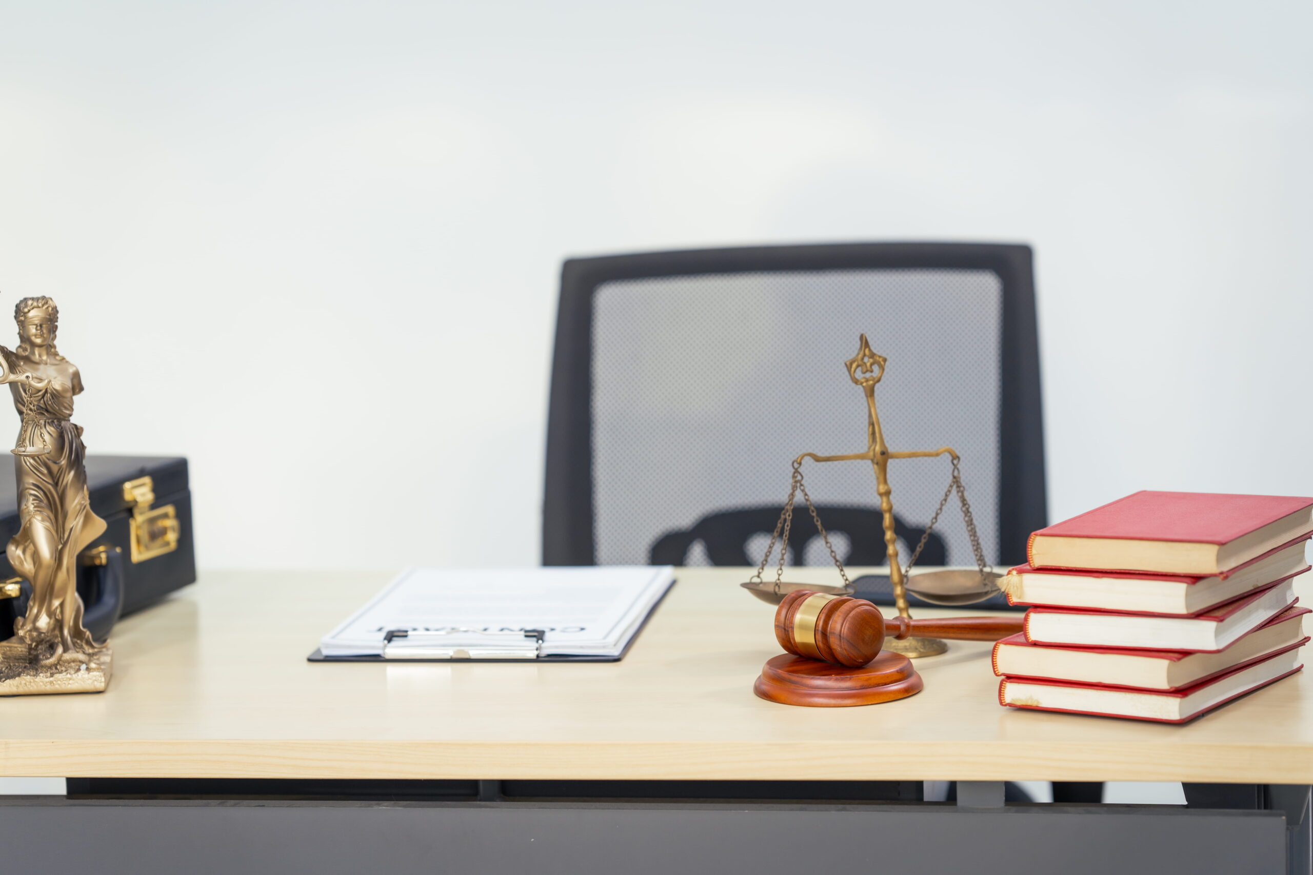 San Diego military crimes defense attorney meeting with a client in a professional law office
